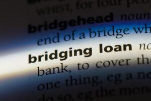 A close-up of a dictionary page, with the term ‘bridging loan’ highlighted.